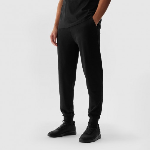 Męskie spodnie dresowe 4F 4FWSS24TTROM603 - czarne