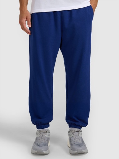 Męskie spodnie dresowe joggery 4F 4FWMM00TTROM1139 - granatowe