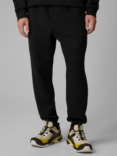 Męskie spodnie dresowe joggery 4F 4FWSS26TTROM1443 - czarne