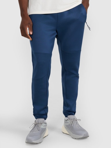 Męskie spodnie treningowe 4F 4FWAW25TFTRM0888 - granatowe