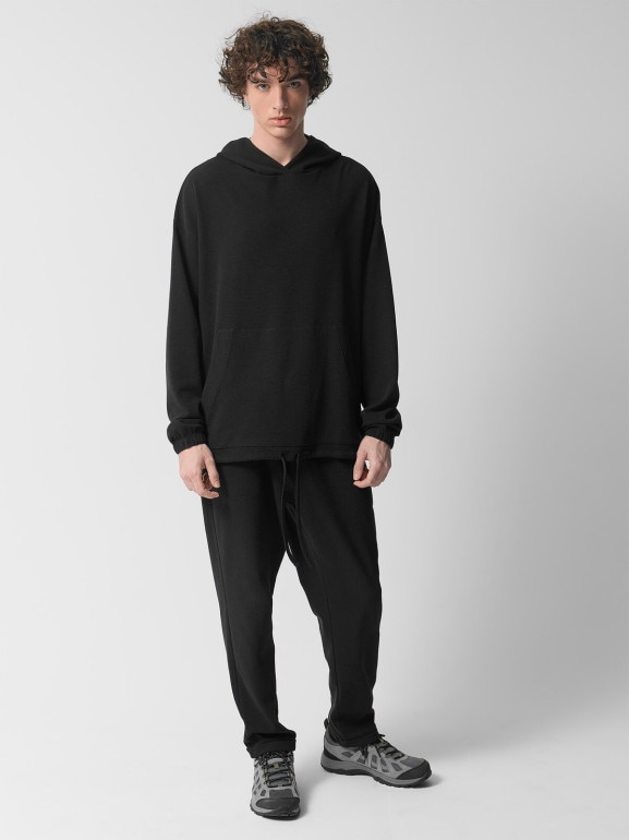 Męskie spodnie dzianinowe Outhorn OTHWSS24TTROM1050 - czarne