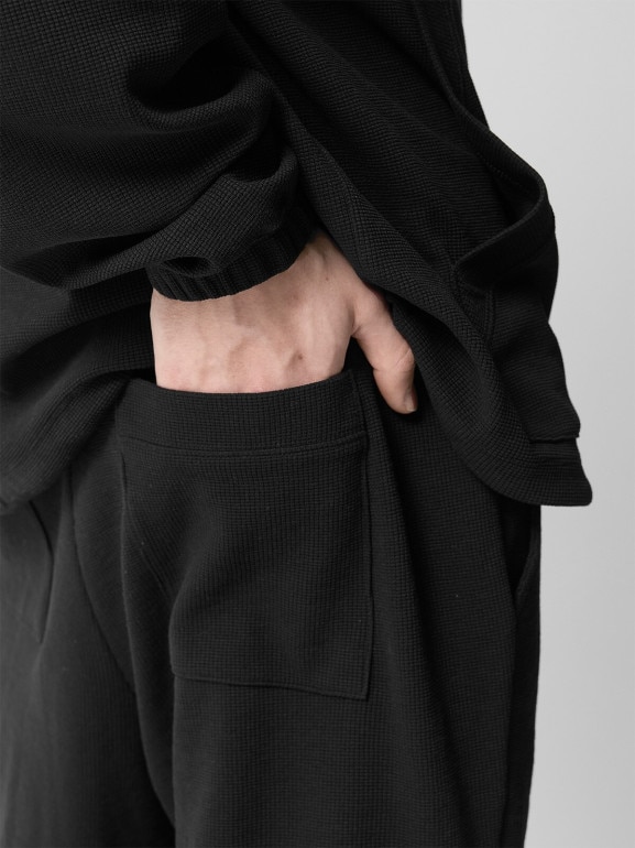 Męskie spodnie dzianinowe Outhorn OTHWSS24TTROM1050 - czarne