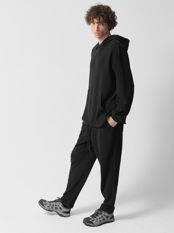 Męskie spodnie dzianinowe Outhorn OTHWSS24TTROM1050 - czarne