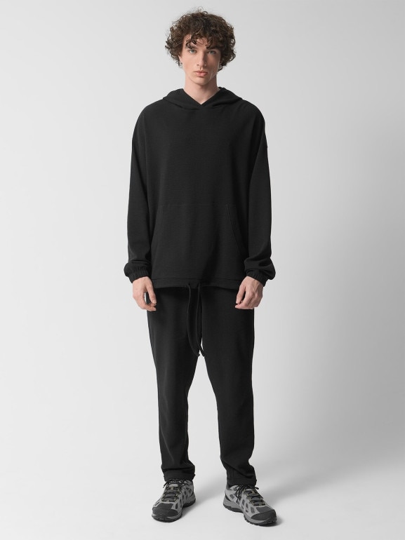 Męskie spodnie dzianinowe Outhorn OTHWSS24TTROM1050 - czarne