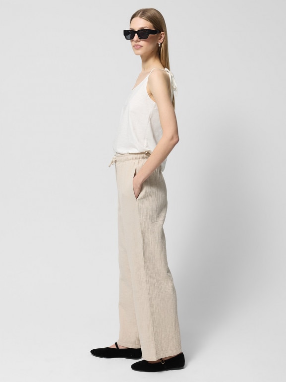 Damskie spodnie Outhorn OTHWSS24TTROF1017 - beżowe