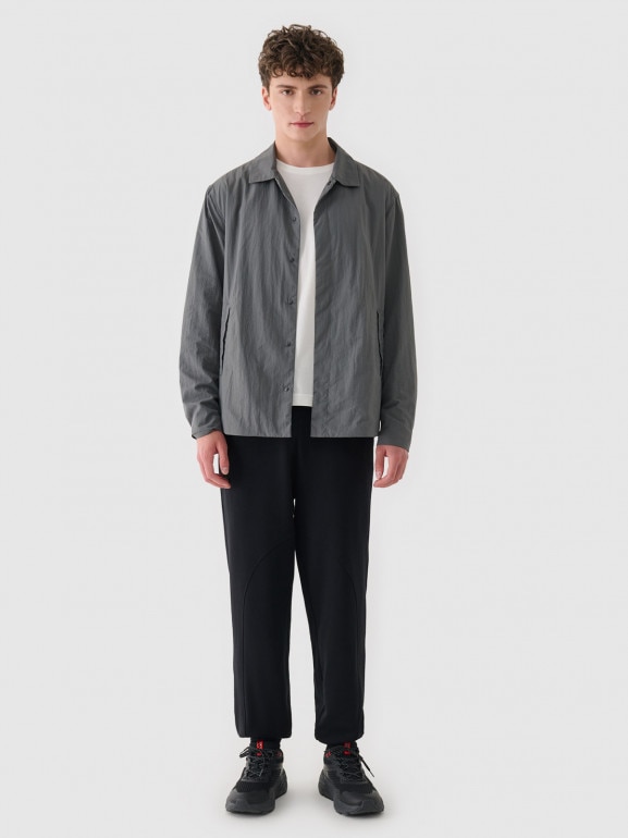 Męskie spodnie dresowe Outhorn OTHWAW24TTROM1218 - czarne