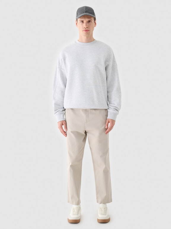 Męskie spodnie casual tkaninowe Outhorn OTHWAW24TTROM1089 - beżowe