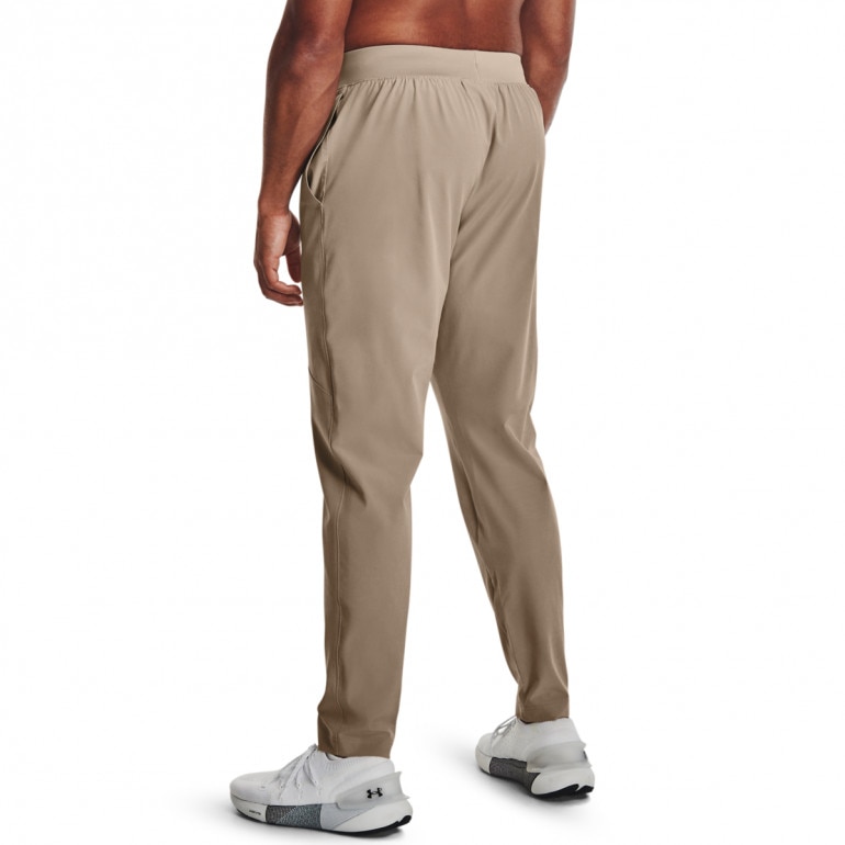 Męskie spodnie treningowe Under Armour UA Strech Woven Pant - beżowe