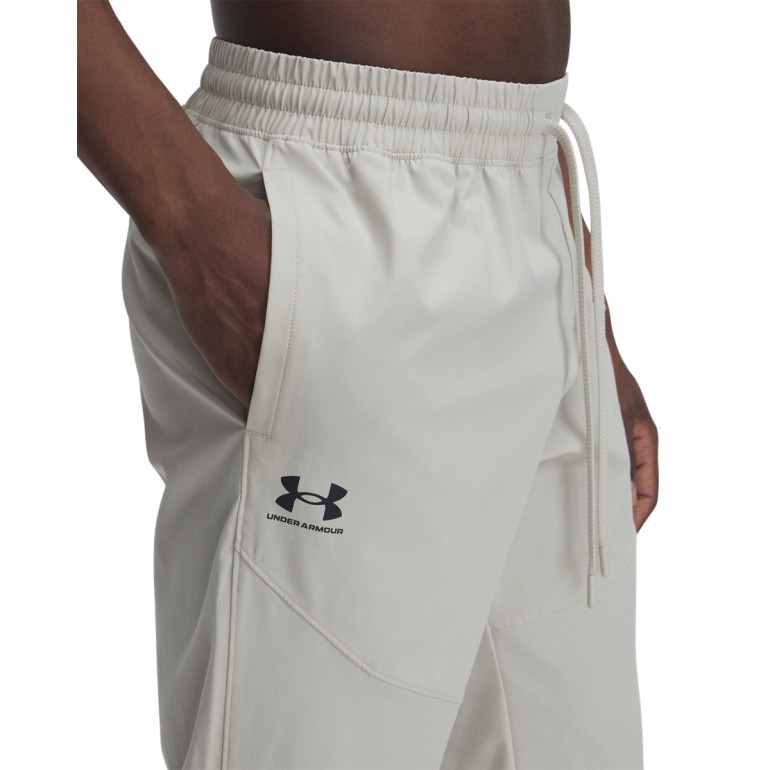 Męskie spodnie treningowe Under Armour UA Vibe Woven Pants -beżowe