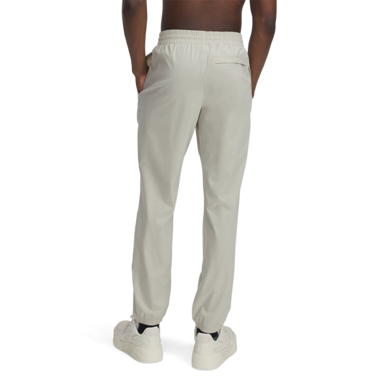 Męskie spodnie treningowe Under Armour UA Vibe Woven Pants -beżowe